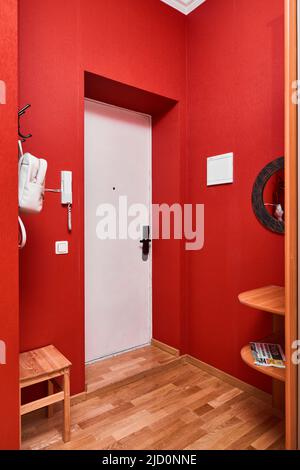 Photo of a stylish hallway with red walls  Stock Photo