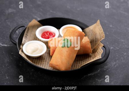 Bandung, Indonesia, 01022021 Close Up Homemade Fried Lumpia Traditional Indonesian Snack, Comfort Street Food  . Served on Chinese New Year Imlek Fami Stock Photo