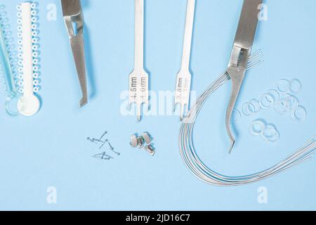 a set of special tools for an orthodontist to install braces for a ...
