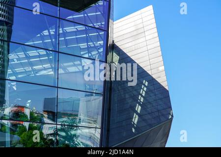 Reflections of the surroundings in the glass facade of BMW World Munich, Germany, 15.5.22 Stock Photo