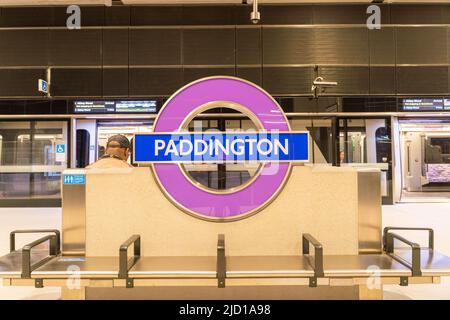 Purple roundel sign installed at London underground station Paddington for Elizabeth line Crossrail purple line England UK Stock Photo