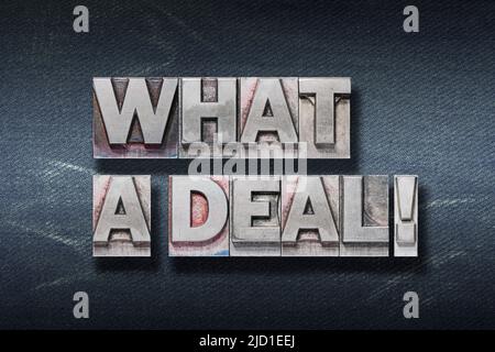 what a deal phrase made from metallic letterpress on dark jeans background Stock Photo
