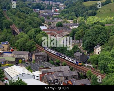 Northern train passenger diesel units 150 107 and 150 134 have just left Todmorden travelling up the Calder Valley towards Walsden and Manchester. Stock Photo