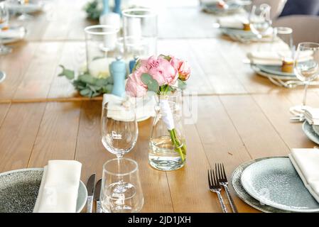 Beautiful outdoor wedding decoration in city. Candles, accessories, bouquets and glasses on table, flat lay, free space, nobody Stock Photo