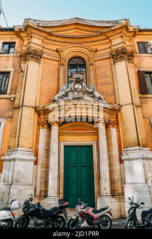 Circa 2019: Rome, Italy: Building in the centre. Green door. Motorcycles in front of the building, architecture. High quality photo Stock Photo