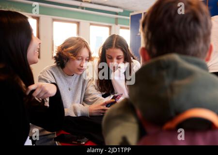 Teenagers in locker room Stock Photo