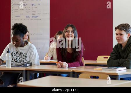 Group of students sitting in class Stock Photo