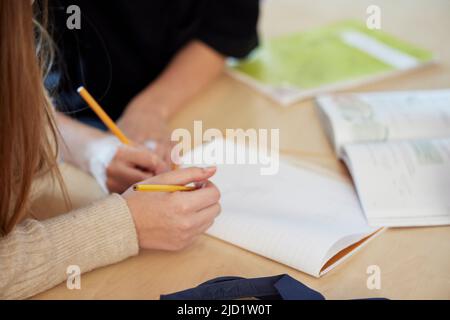 Students taking notes in class Stock Photo