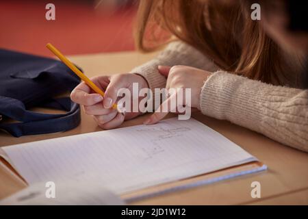Student taking notes in class Stock Photo