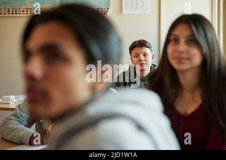 Group of students sitting in class Stock Photo