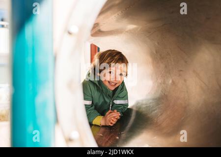 Boy having fun on playground Stock Photo