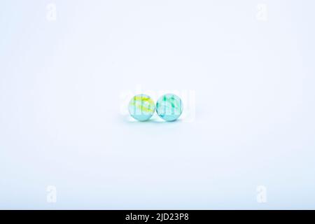 Colored glass balls and marble taw, children's toys, decoration Stock Photo