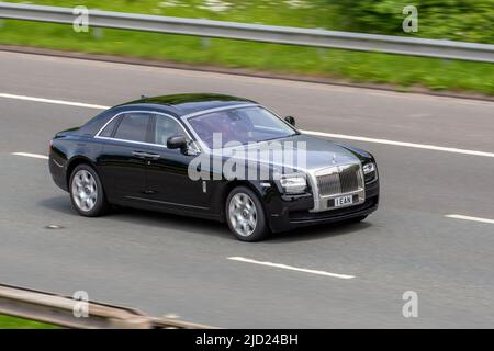 2011 black silver British ROLLS ROYCE GHOST BV12 SWB 6592cc petrol 8 speed automatic; driving on the M6 Motorway, Manchester, UK Stock Photo
