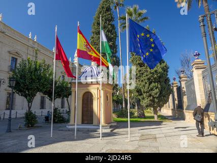 Flags At The Entrance To The University of Seville (Universidad de Sevilla), Seville Spain, Stock Photo