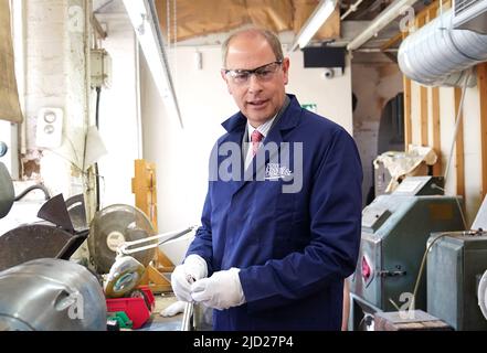 The Earl of Wessex, polishing a Commonwealth games medal during a visit to Toye, Kenning and Spencer in Birmingham. Picture date: Friday June 17, 2022. Stock Photo