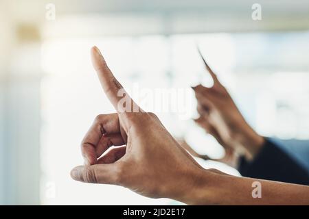 Just a few questions. Closeup shot of unrecognizable people raising their hands to ask a question. Stock Photo