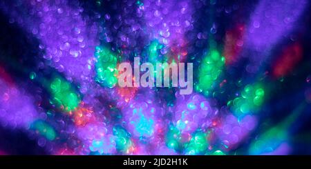 Abstract background with blurred lights, colorful bright color backdrop, purple futuristic banner, round bokeh in shape of a circle Stock Photo
