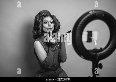 Happy drag queen fashion blogger streaming online - Black and white editing Stock Photo