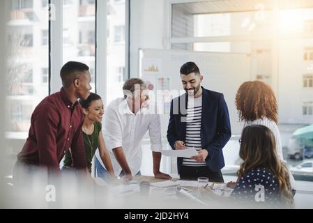 We do more than brainstorm, we brain hurricane. Shot of creative employees working in a modern office. Stock Photo