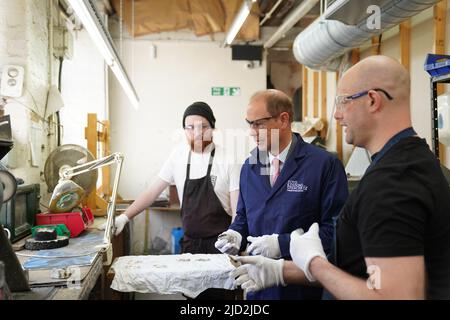 The Earl of Wessex, polishing a Commonwealth games medal during a visit to Toye, Kenning and Spencer in Birmingham. Picture date: Friday June 17, 2022. Stock Photo