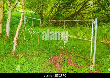 North German agricultural field forest and nature landscape panorama with old broken gate and fence in Pipinsburg Geestland Lower Saxony Germany. Stock Photo