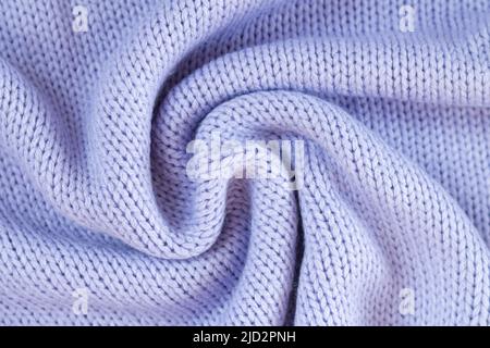 Texture of knitted woolen purple cloth. Winter sweater background Stock Photo