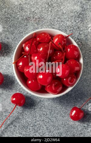 Sweet Candied Red Maraschino Cherries in a Bowl Stock Photo