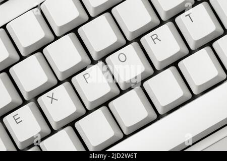 EXPORT write on the white computer keyboard. Import and export business. Stock Photo