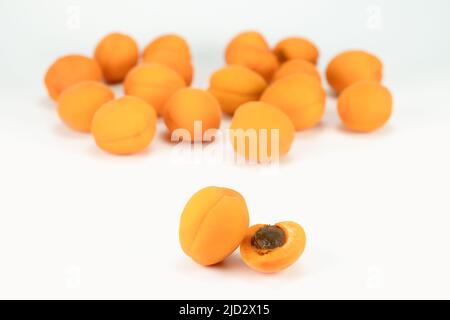 Ripe apricots isolated on the white background. Close up view. Selective focus. Stock Photo