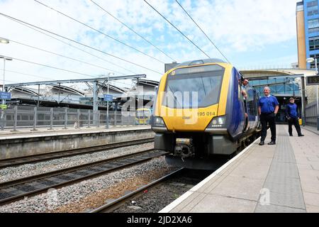 Northern Trains Class 195 local train with rail crew staff wait to depart from Leeds train station with a service to Lincoln in June 2022 Stock Photo