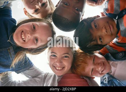 Together we can do so much more. Cropped shot of elementary school children in class. Stock Photo