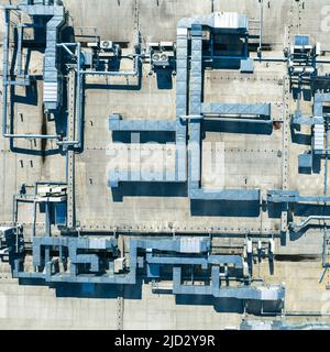 Air Condition Ventilation System on the Building Roof. Industrial Air system of ventilation and Air conditioning. Aerial Shot. Stock Photo