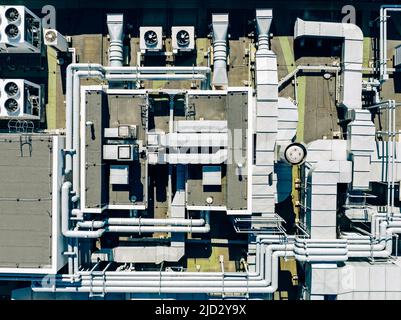 Air Condition Ventilation System on the Building Roof. Industrial Air system of ventilation and Air conditioning. Aerial Shot. Stock Photo