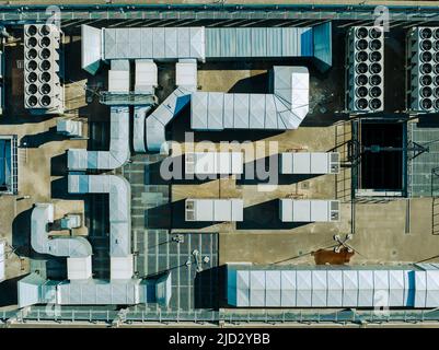 Air Condition Ventilation System on the Building Roof. Industrial Air system of ventilation and Air conditioning. Aerial Shot. Stock Photo