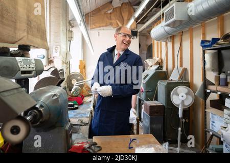 The Earl of Wessex polishing a Commonwealth Games medal during a visit to Toye, Kenning and Spencer in Birmingham, who are producing the medals for the Birmingham 2022 Commonwealth Games. Picture date: Friday June 17, 2022. Stock Photo