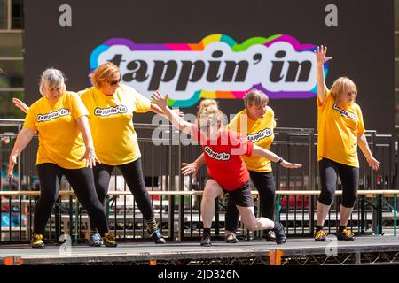 Amateur tap dancers performing in public in a summer dance festival, UK 2022 Stock Photo