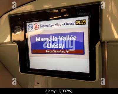 Paris, France - 04/05/2022: Information screen of Disneyland train. Disneyland stop Marne La Valle Chessy shown on Screen. Stock Photo