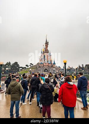 Paris, France - 04/05/2022: Sleeping Beauty Castle at cloudy weather ... Weird People At Disneyland