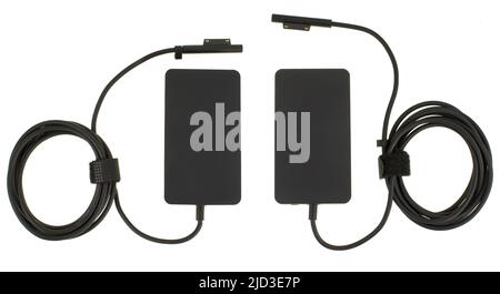 laptop power adapter, laptop spare part on white background, top view Stock Photo