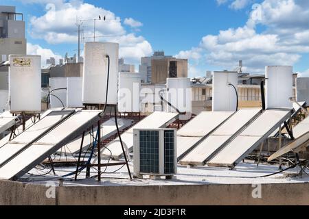 A lot of solar water heating systems installed on the roof of the house in Israel Stock Photo