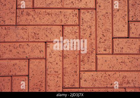 Redbrick paving stones on a sidewalk or pavement. Top view, copy space Stock Photo