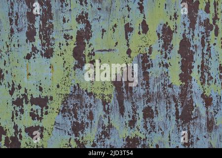 Background is sheet rusty and old metal with peeling green paint Stock Photo