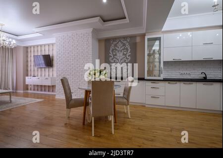 Luxury modern studio apartment with dining table and living room Stock Photo