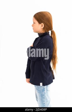 Portrait of a boy with long hair on the side on a white background. Isolated.Studio light. High quality photo Stock Photo