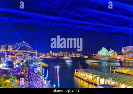 Sydney harbour Circular quay and The Rocks brightly illuminated at Vivid Sydney lights festival at night. Stock Photo