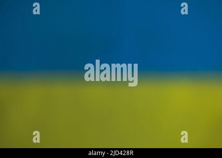 Close up texture view in defocus of abstract design of flag of Ukraine. Stock Photo