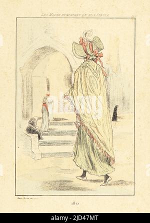 Fashionable woman in front of a church, Paris, 1815. She wears a bonnet with ribbons, long embroidered shawl, ankle-length dress. Handcoloured drypoint or pointe-seche etching by Henri Boutet from Les Modes Feminines du XIXeme Siecle (Female Fashions of the 19th Century), Ernest Flammarion, Paris, 1902. Boutet (1851-1919) was a French artist, engraver, lithographer and designer. Stock Photo