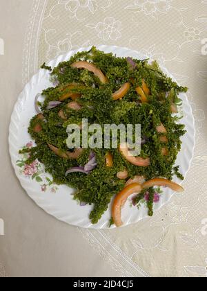 Photo of sea grapes or lato Caulerpa lentillifera, a species of ulvophyte green algae of the edible Caulerpa prepared as salad served on a plate which Stock Photo