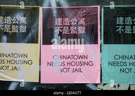 Chinatown Needs Housing Not Jail. Colourful wheatpaste posters in Chinatown, New York City, United States of America. Stock Photo