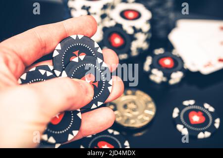 Poker Player Counting Chips After a Good Bet and Successful Round. Having Fun in Casino. Gambling Industry Theme. Stock Photo